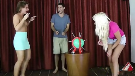 2 girls and one guy play a don't pop the balloon game